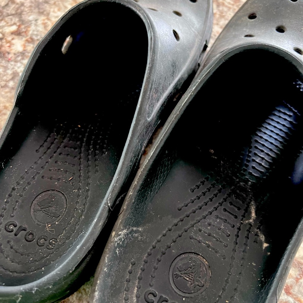 Black Crocs slip ons